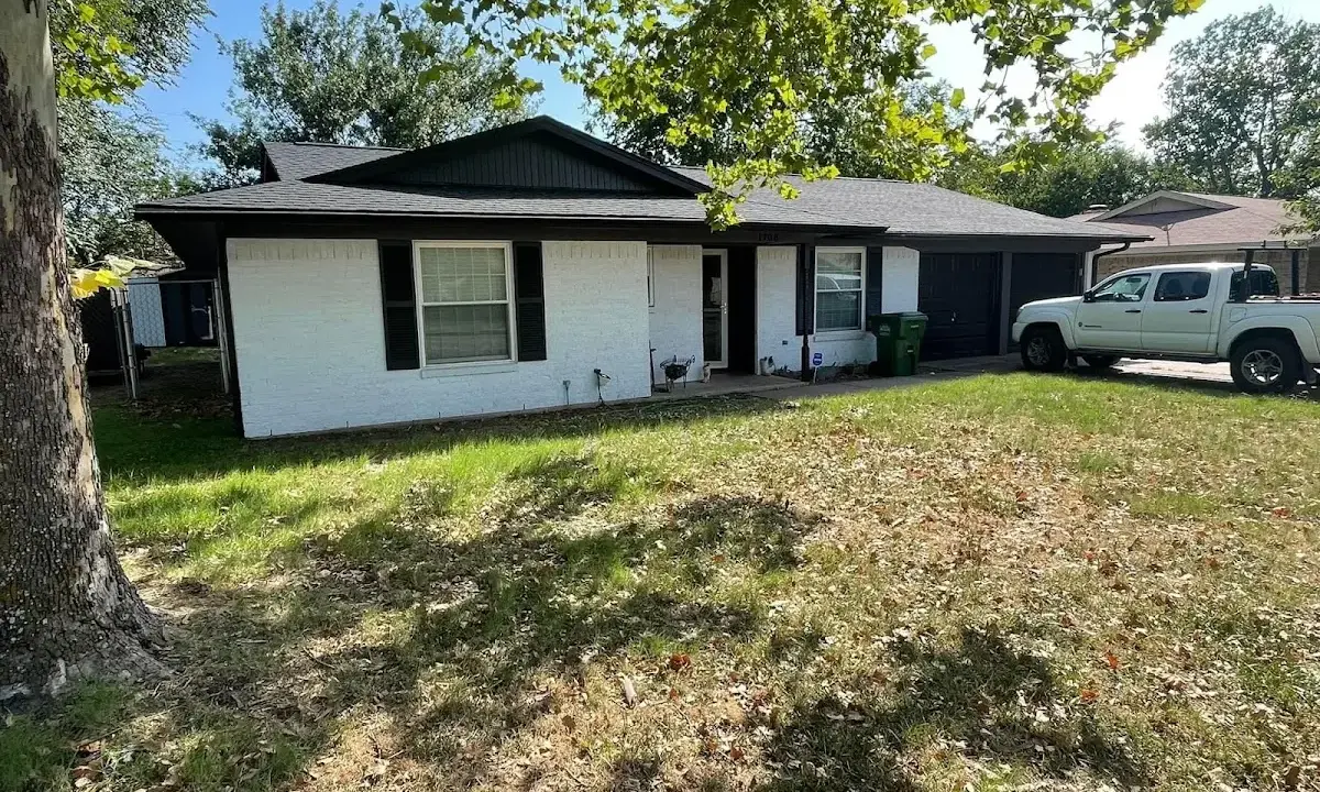 Professional roofing crew working on a residential roof in Selah